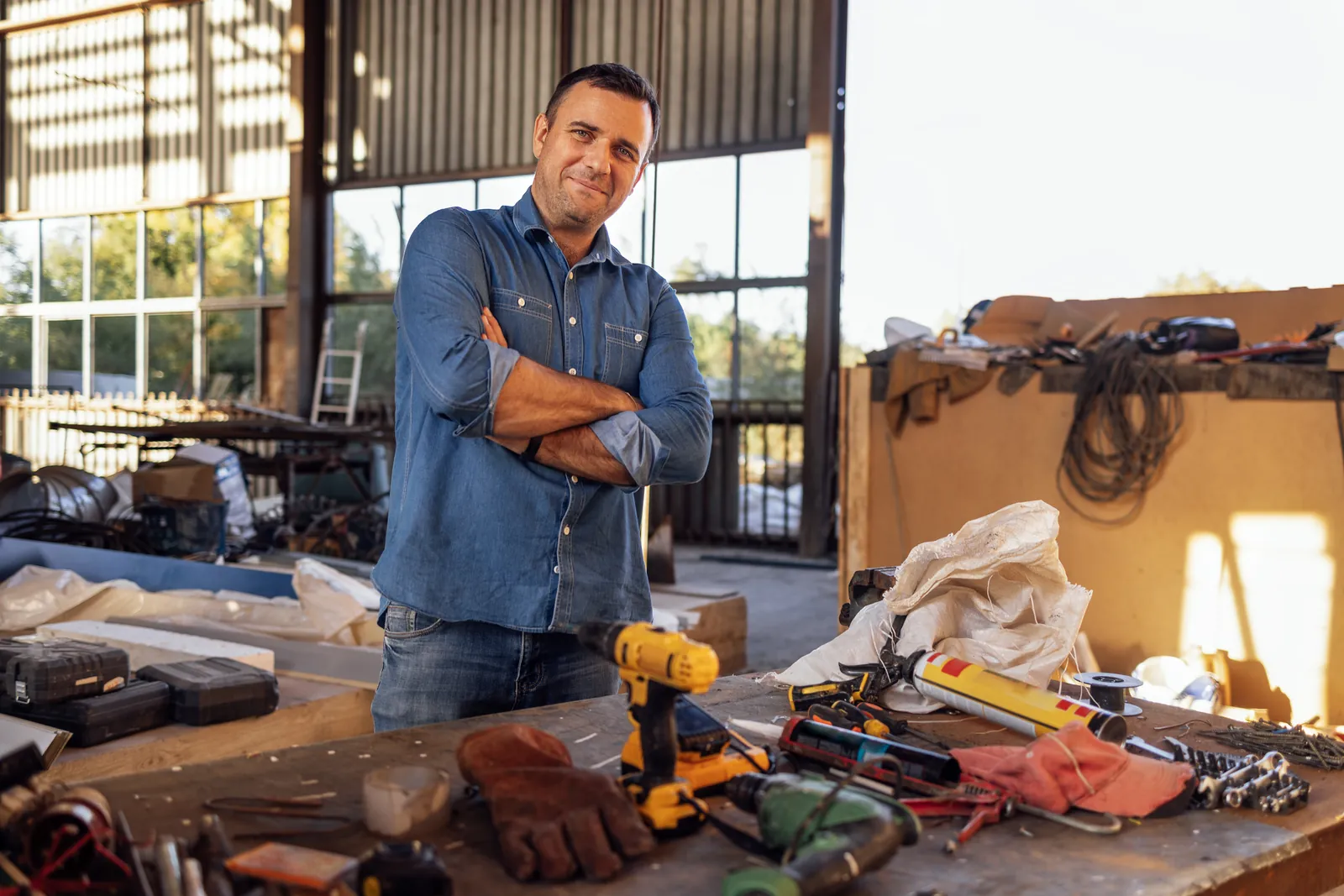 A small business owner standing in his workshop